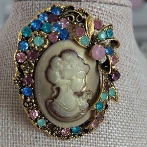 Elegant Gold Cameo Brooch with Multicolor Accents